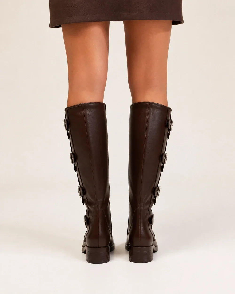 Brown knee-high multi-buckle biker boots rear view